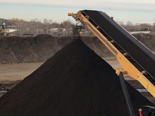 tree composted into rich black soil